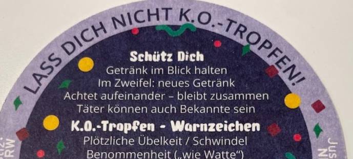 Die wichtigste Hinweise zum Schutz gegen K.O.-Tropfen auf einem Bierdeckel